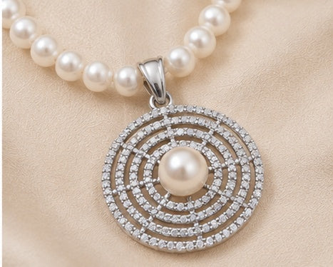 White freshwater cultured pearl circular pendant with rhodium finish