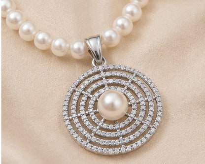 White freshwater cultured pearl circular pendant with rhodium finish